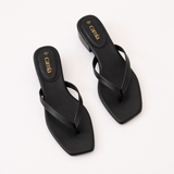 Black Leather sandals with 'Camila' branding on a white background